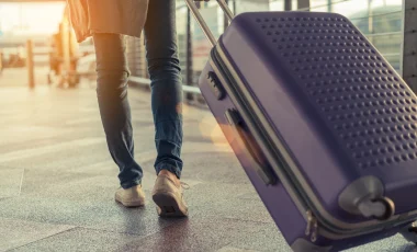 Traveler pulling luggae at the airport